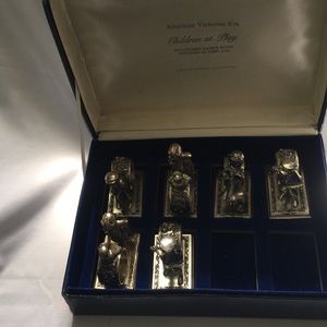 Children at play sculpture silver napkin rings.
